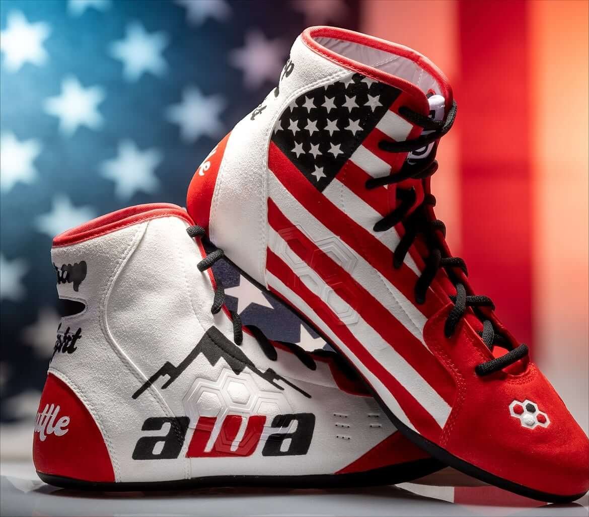 Custom hand-painted wrestling shoes with American flag design in orange and white